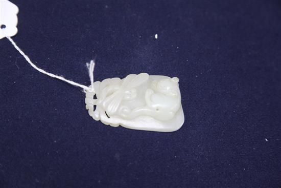 A Chinese pale celadon jade pendant, 19th century, length 6.7cm